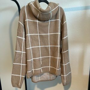 Tan cowl neck sweater with white checks